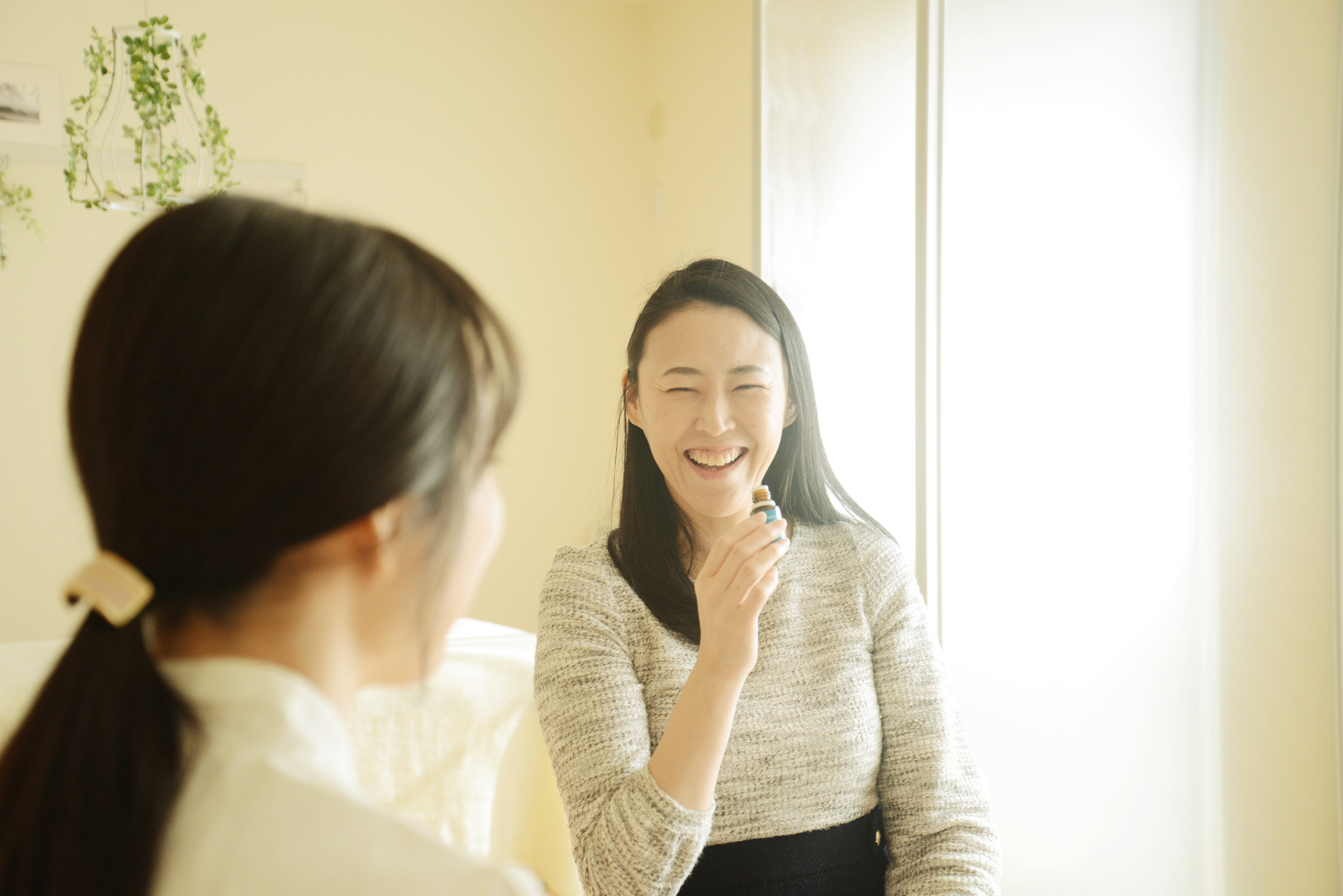 Young woman's aromatherapist counseling patient